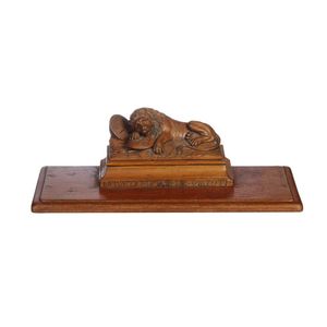 A Victorian carved wooden inkstand on a base after the 'Lion of…