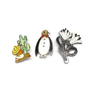 Three enamel and silver figural brooches all with Mexican…