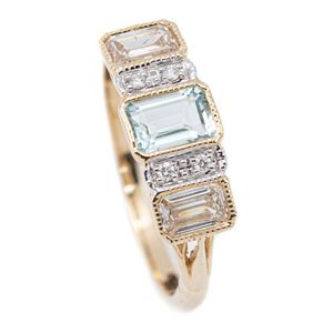 A 9ct gold aquamarine and diamond ring, centring an emerald cut…