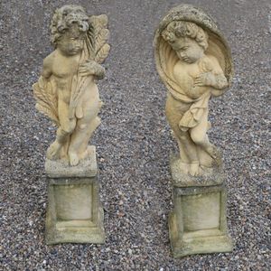 A pair of Church Stone garden statues on plinths, 'Autumn' and…