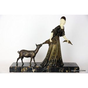 A signed Art Deco spelter figure of a woman with a goat, circa…