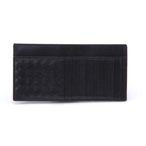 A tourmaline card case by Bottega Veneta, styled in black…