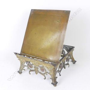 A Victorian brass bible stand, the highly decorative brass…