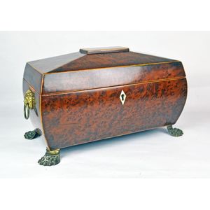A late Georgian tea caddy of bombe shape in burr yew or amboyna…