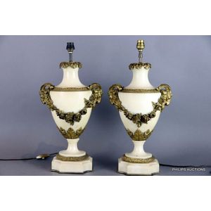 A pair of neoclassical bronze mounted marble lamp bases, 19th…
