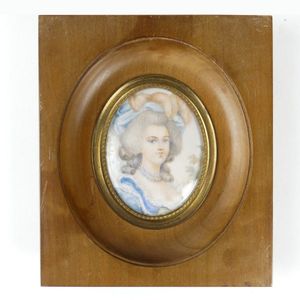 A hand painted portrait miniature on ivory, a woman painted in…