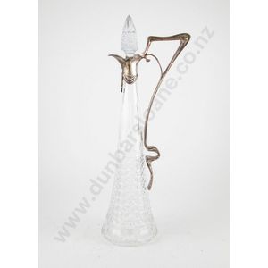 An elegant Art Nouveau WMF style claret jug with faceted and…
