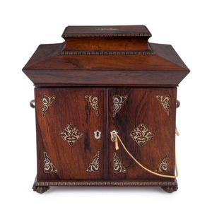 A rosewood sarcophagus form jewellery box, mother of pearl…