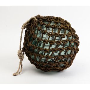 A vintage glass fishing buoy with rope binding, mid 20th…