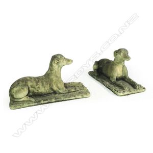 A pair of Church Stone greyhounds, in lying position, on plinth…