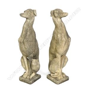 A pair of classical Church Stone greyhounds, in seated position,…