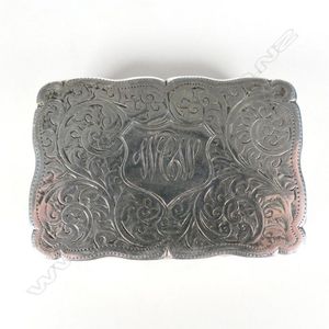 An Edwardian silver snuff, the exterior profusely engraved, the…