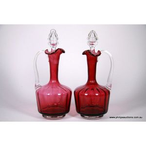 A pair of Victorian ruby glass decanters, later 19th century,…