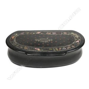 A 19th century papier-mache snuff box, curved front, the lid…