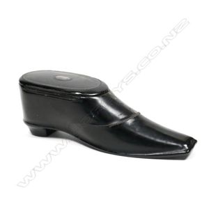 A 19th century papier-mache snuff box, in the form of a boot…