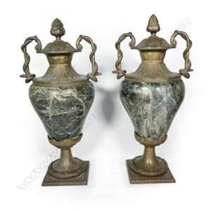 A pair of substantial granite and brass urns, the inverse…