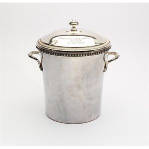 A silver plated twin handled wine cooler and cover, French…