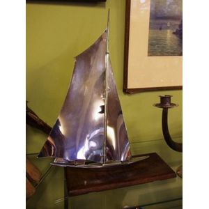 Art Deco chrome model yacht, on timber base, 46 cm high approx