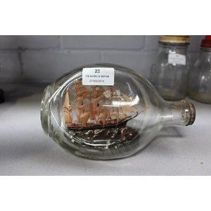 Model ship in glass bottle, approx 12 cm high, 20 cm long