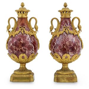 A pair of rouge marble and ormolu mounted cassolettes, baluster…