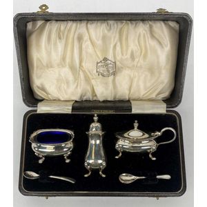 A cased five piece silver plate cruet set, comprising a salt…