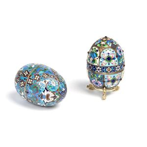 Two Russian Faberge eggs opulently embellished, one signed…