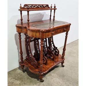 A Victorian walnut canterbury, the superstructure above a…
