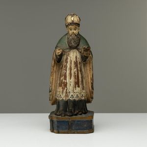 An early carved timber Santos religious figure, height 37 cm