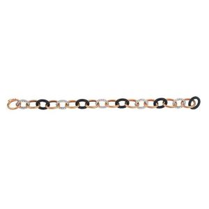 A diamond, onyx and gold bracelet, the oval belcher links…