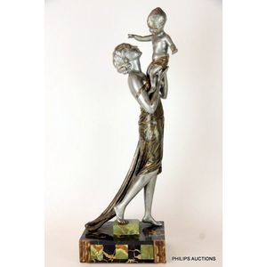 A signed Art Deco cold painted spelter figure of a woman…