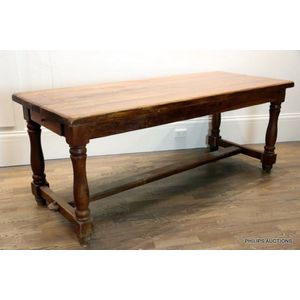 An oak refectory style farm table, circa 1930, the plank top in…