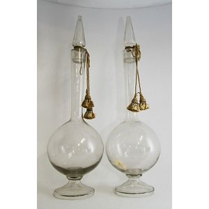 A pair matching large swan neck carboys with cut crystal spire…