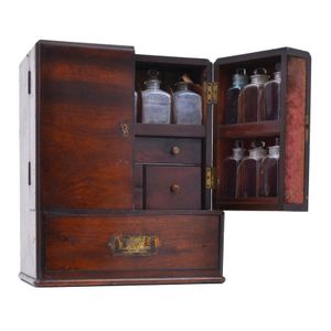 A Victorian travelling apothecary set, double doors opening to…
