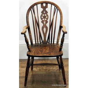 An elm Windsor chair, late 19th century the arched back with&hellip;