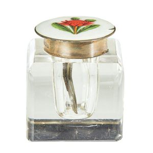 A sterling silver and enamelled topped inkwell, the circular…