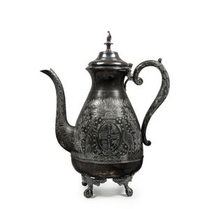 A silver plated teapot engraved with the Australian coat of…