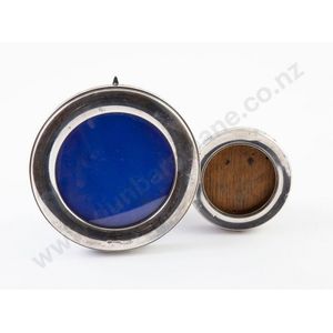 Two sterling silver circular photograph frames, 11 cm and 7 cm…