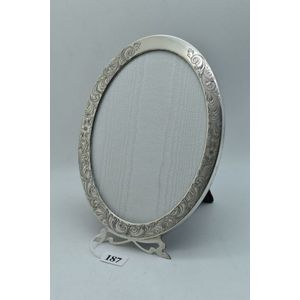 Sterling silver oval photo frame with engraved scroll…