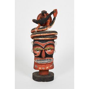 Melanesian carved and painted sculpture, wood, with red, black,…