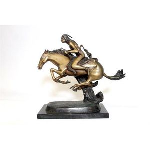 A large vintage bronze Remington style statue depicting Indian…