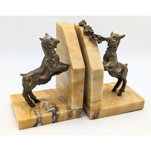 Art Deco bookends, marble base supporting playful brass goats