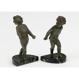 A pair of figural metalware bookends, cupid figures in a&hellip;