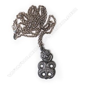 A circa 1940 cast silver hei tiki pendant, presentation&hellip;