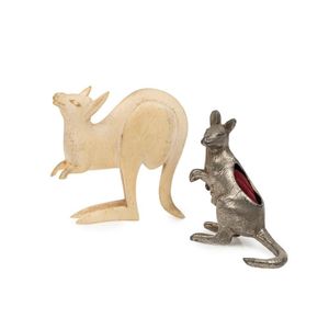 A silver plate kangaroo pin cushion and a carved ivory kangaroo,…