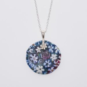 A multi colour 28 mm round glass pendant by Peter Raos, hanging…