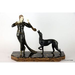 An Art Deco painted spelter figure group of a young woman and a…