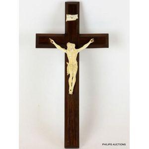 A carved ivory Corpus Christi, mounted on a chamfered rosewood…