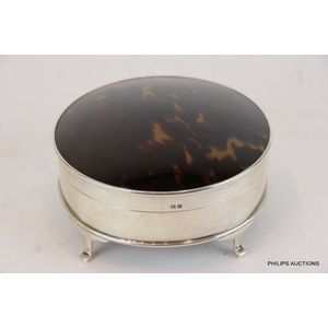 A round sterling silver and tortoiseshell jewellery box,…