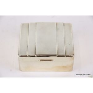 A sterling silver cigarette box, a sterling silver cigarette box