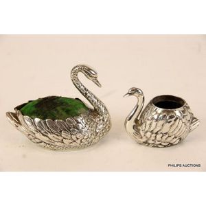 Two sterling silver swan pin cushions, sterling .950, and…
